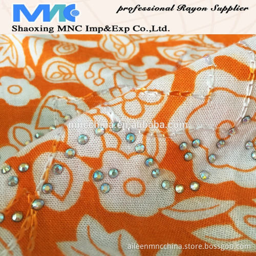 RAYON PRINT WITH EMBROIDERY AND STONE FABRIC